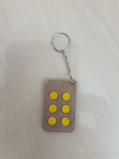 Cela Braille em forma de chaveiro